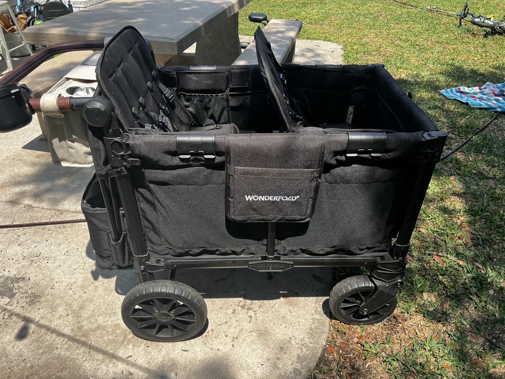 WonderFold W4 Luxe Pro Stroller Wagon - Collapsible Stroller Wagon with Aluminum Frame - Adjustable Canopy & Push Handle - XL All-Terrain Wheels - For Babies, Toddlers & Kids - 4 Seater - Black customer photo 2