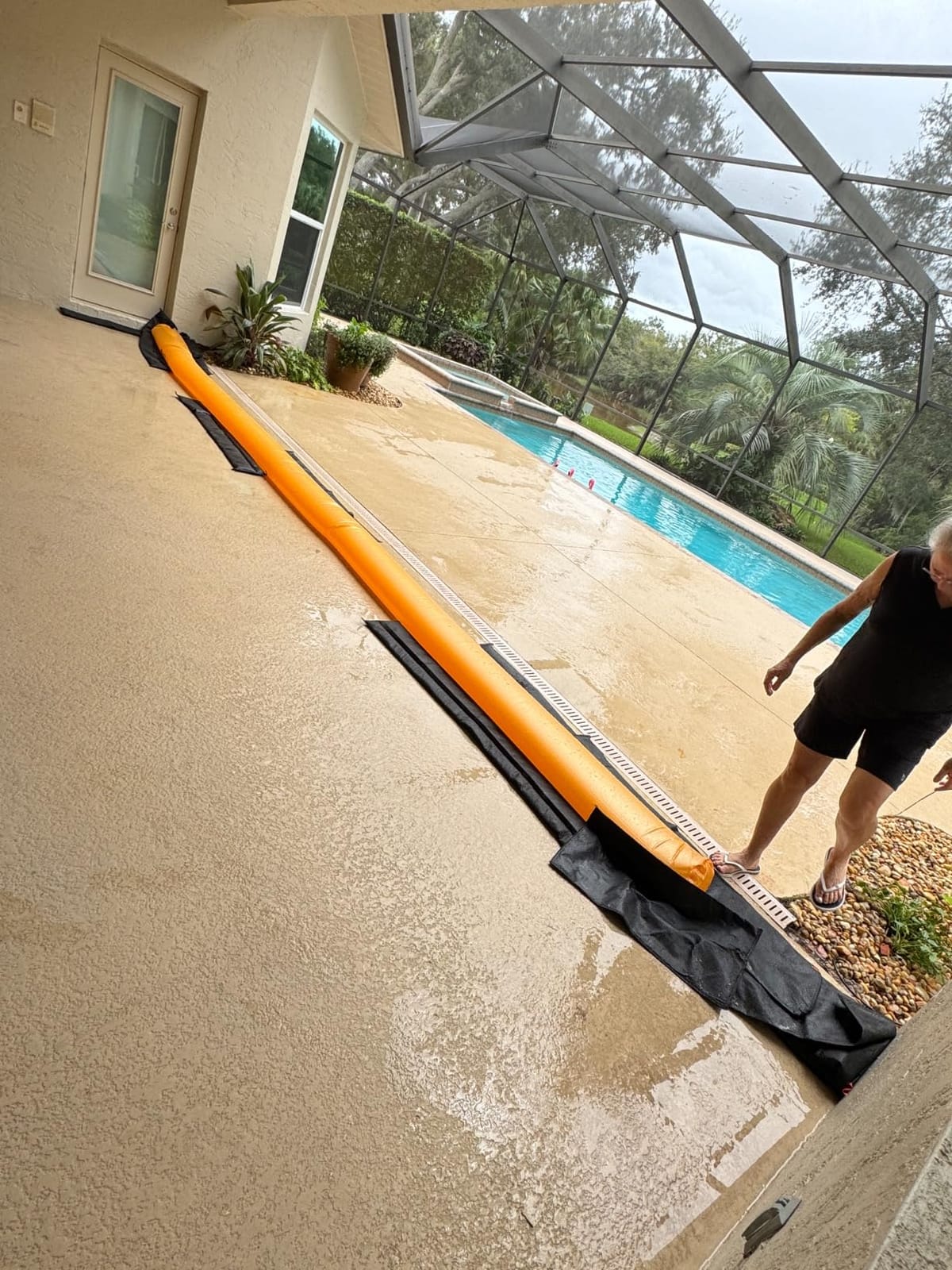 The Original HydraBarrier Standard Flood Barrier – 6 ft Long x 4 in High – Light, Reusable Sandbag Alternative – Flood Control & Diversion Tube for Home, Garage, Door & Property Protection customer photo 1