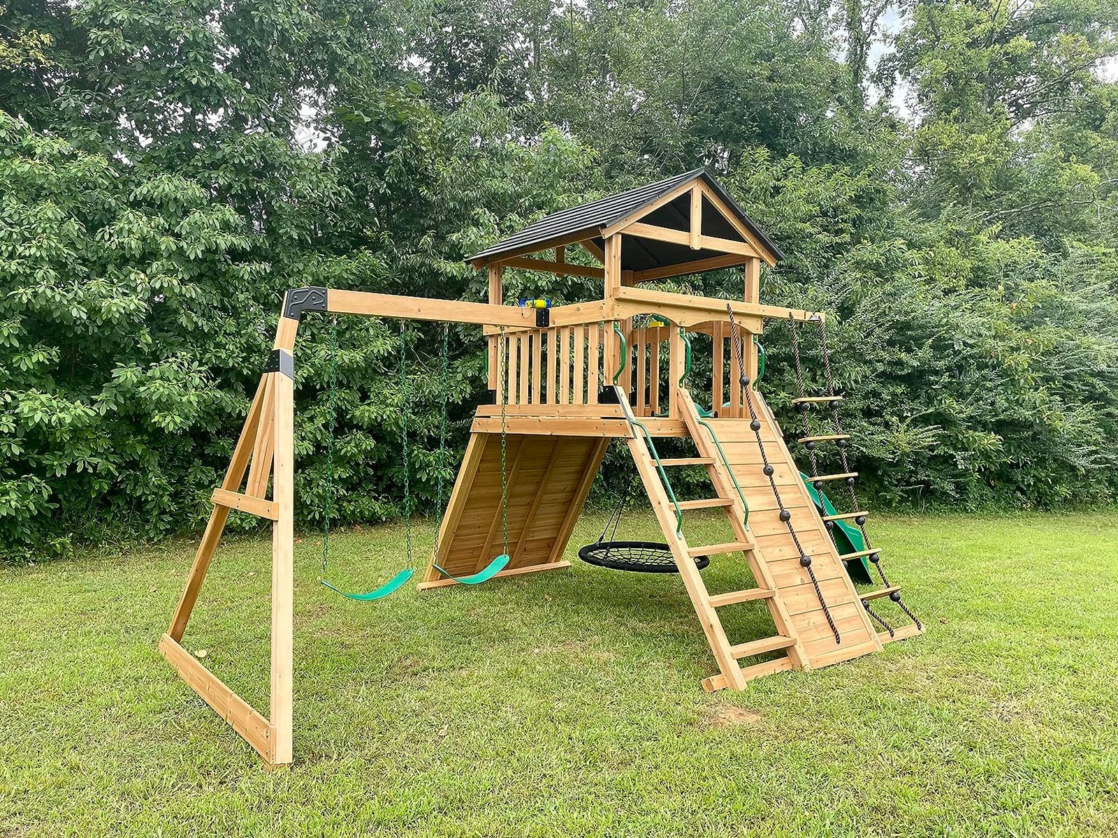 Backyard Discovery Endeavor Cedar Wood Swing Set with Wave Slide, Play Deck, Double Rock Wall, Rope Ladder, Climbing Wall, Belt Swings, 40-Inch Web Swing, Step Ladder, Toy Telescope, Outdoor Playset customer photo 1