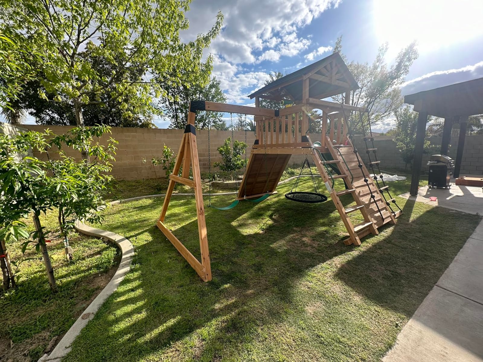 Backyard Discovery Endeavor Cedar Wood Swing Set with Wave Slide, Play Deck, Double Rock Wall, Rope Ladder, Climbing Wall, Belt Swings, 40-Inch Web Swing, Step Ladder, Toy Telescope, Outdoor Playset customer photo 2